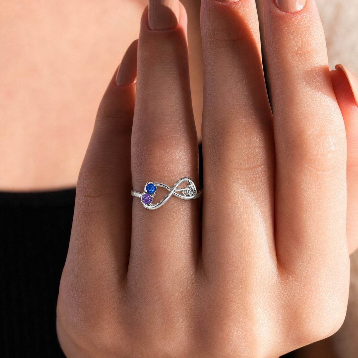 Infinity Birthstone Ring on hand view custom jewelry
