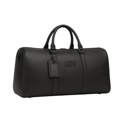 Luxurious personalized black leather duffle bag with embossed custom monogram for men or women.