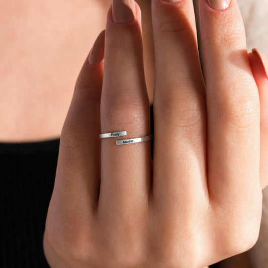 Personalized matching name ring shown on hand