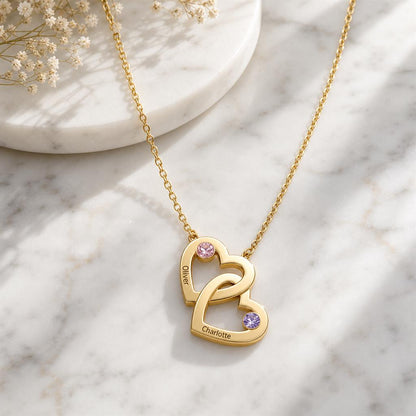Mom child heart necklace on marble