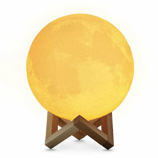 Personalized 3D photo engraved moon lamp on a wooden stand, showing a custom couple's portrait illuminated.