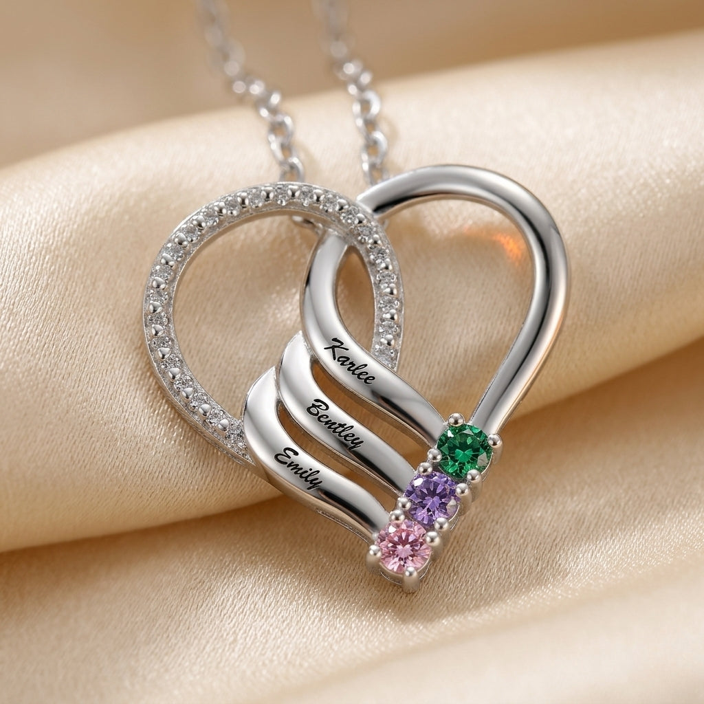 Silver heart pendant featuring 3 names and birthstones.