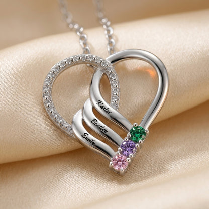 Silver heart pendant featuring 3 names and birthstones.