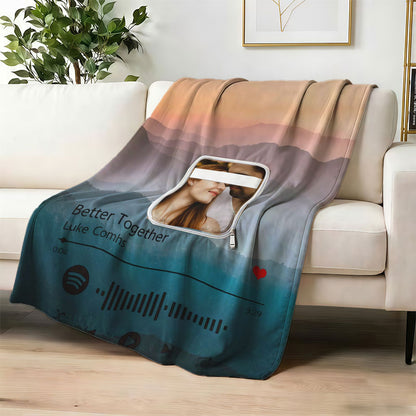 Custom music player blanket with couple photo on sofa.
