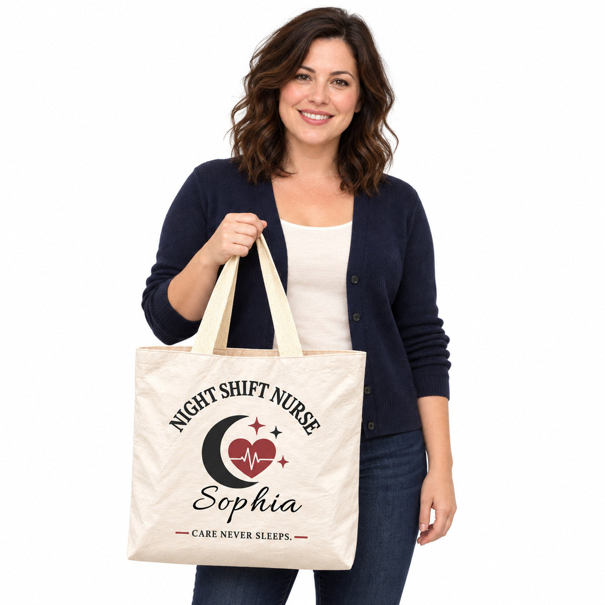 Cream Night Shift Nurse tote personalized with Sophia, displayed by a model against a white background.
