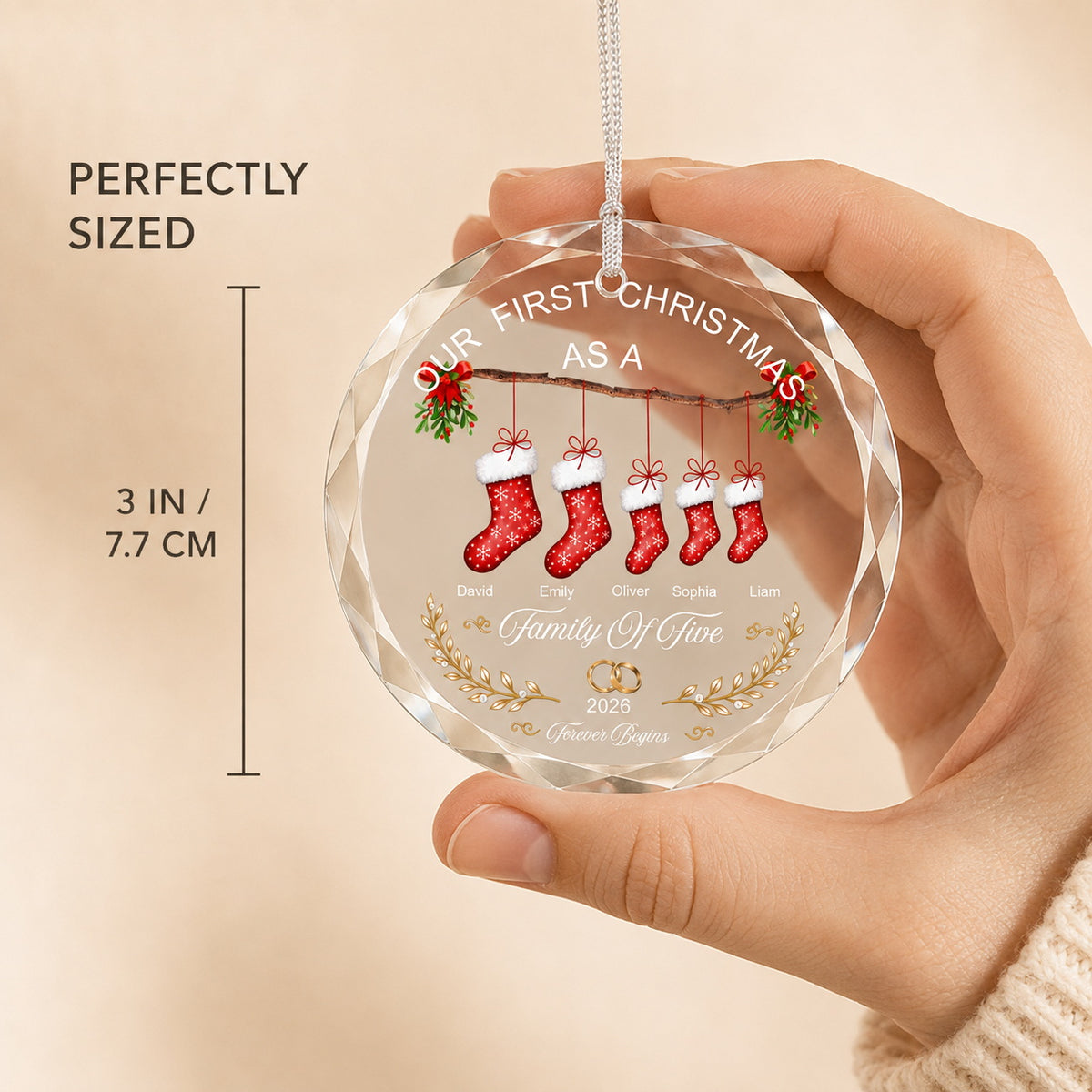 Personalized Christmas ornament size reference showing a 3 inch clear round family keepsake held by hand