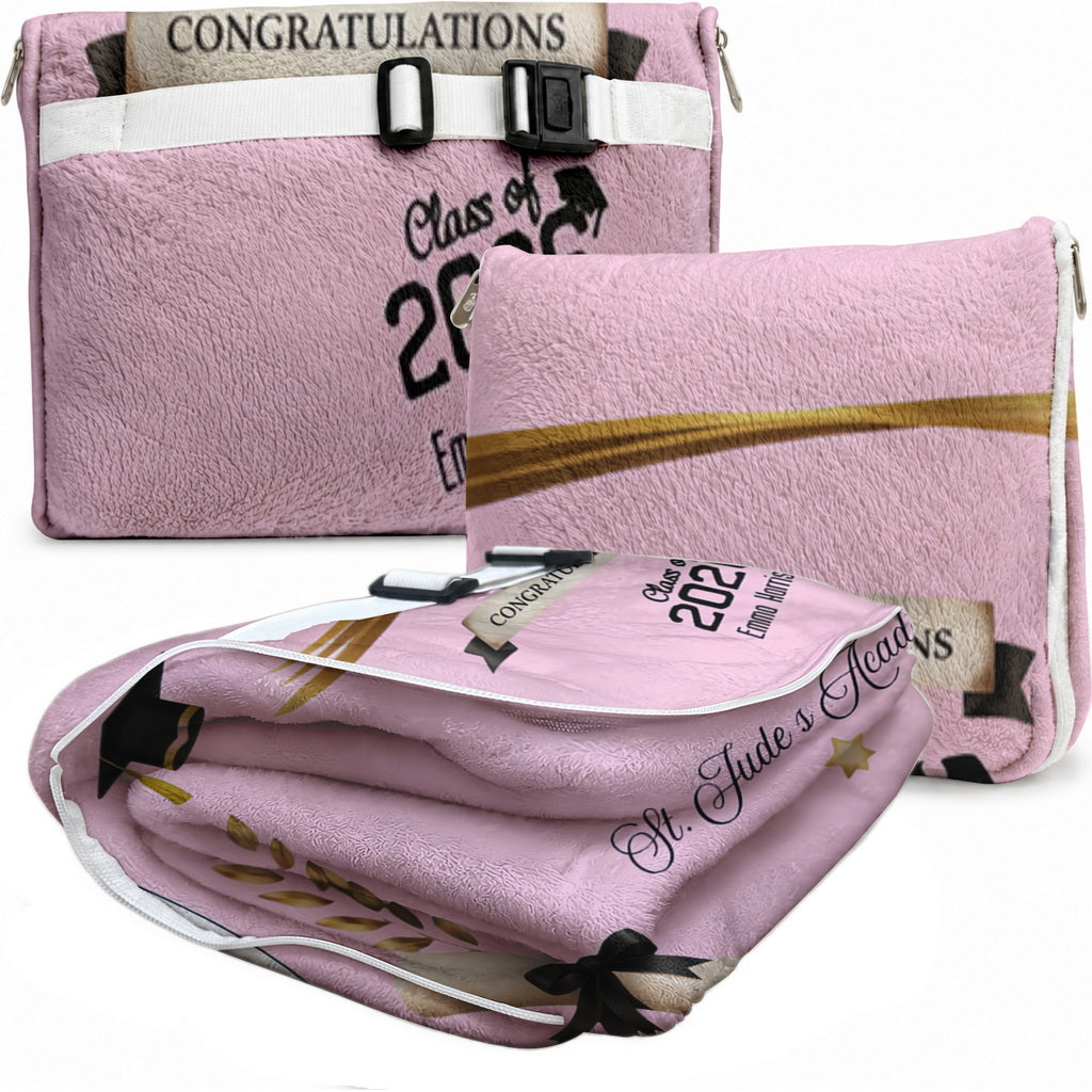 Folded pink graduation blanket featuring custom name and school.