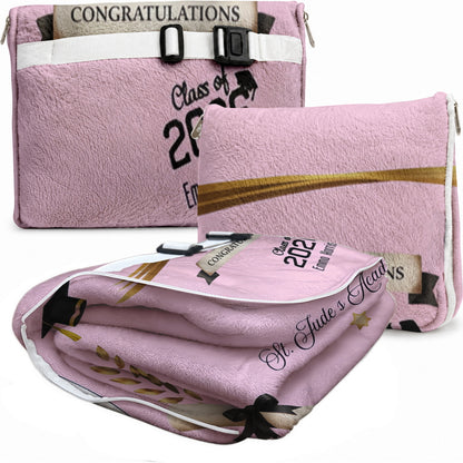 Folded pink graduation blanket featuring custom name and school.