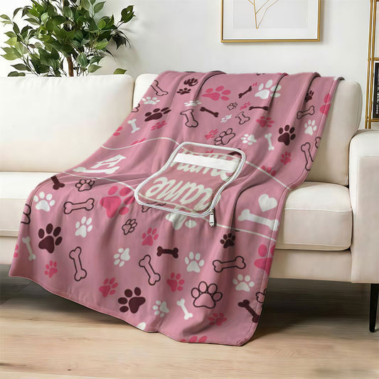 Custom name dog paw print blanket on white sofa