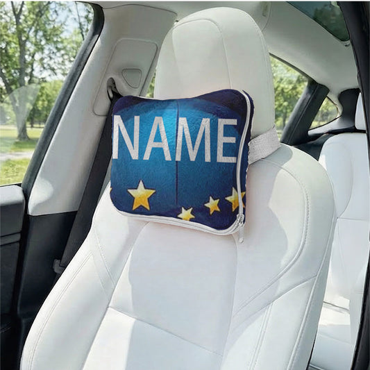 Personalized graduate name pillow as a car headrest.