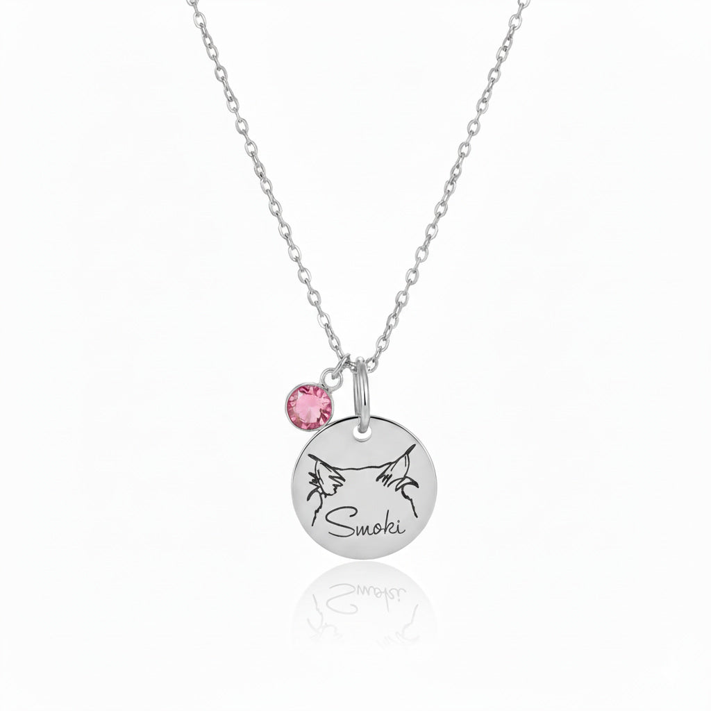 Silver personalized name necklace with pink birthstone and custom pet engraving.
