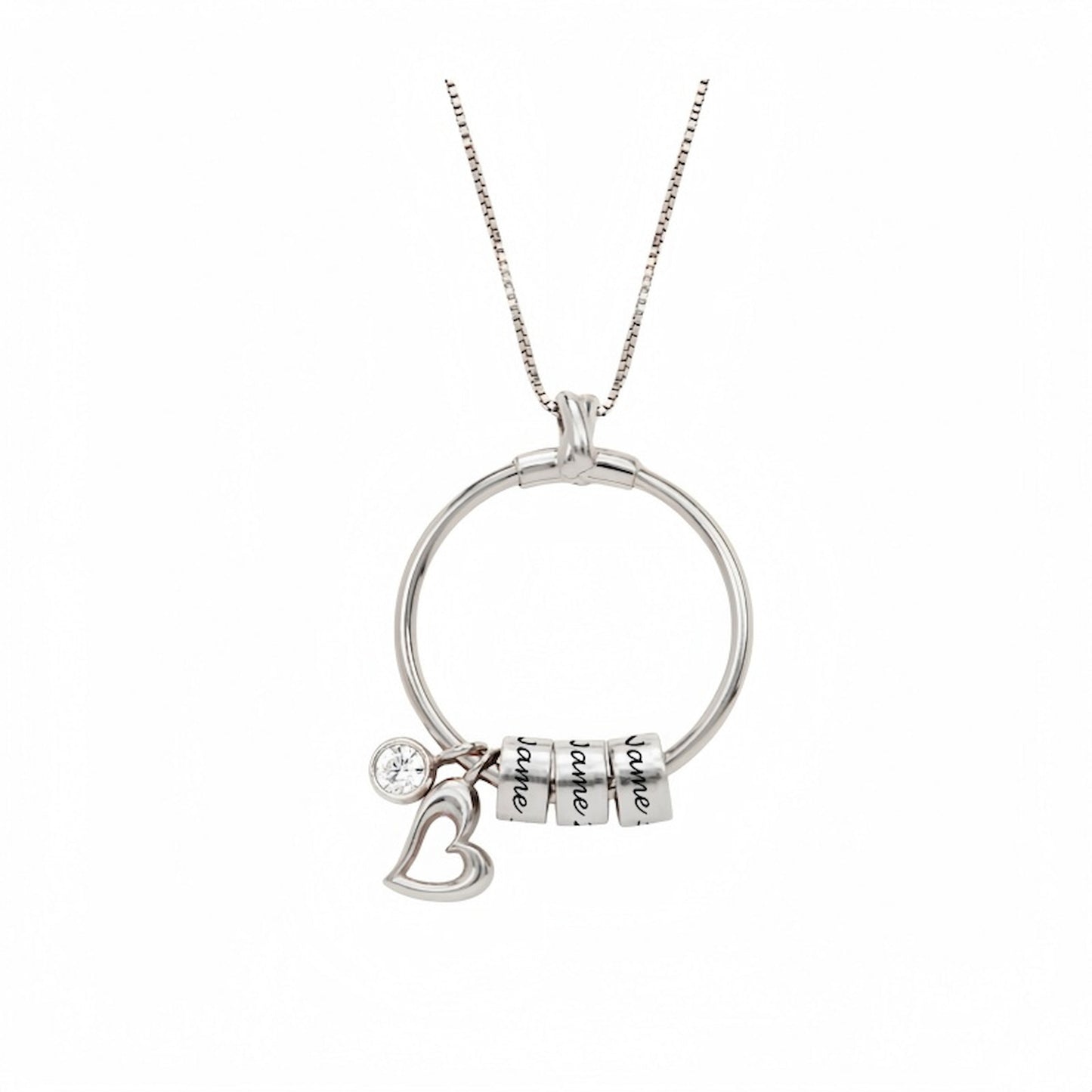 Close-up shot of the personalized sterling silver circle necklace with 3 engraved name beads and a heart charm with CZ stone.
