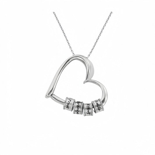Sterling silver personalized heart necklace with four engraved stacking beads.