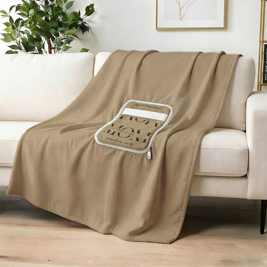 Custom tan blanket with personalized name text on sofa