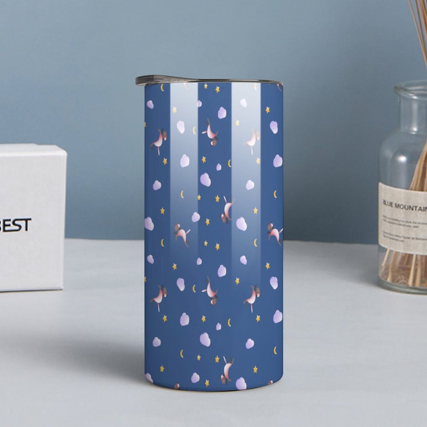 Personalized unicorn tumbler stainless steel cup lifestyle shot on desk.