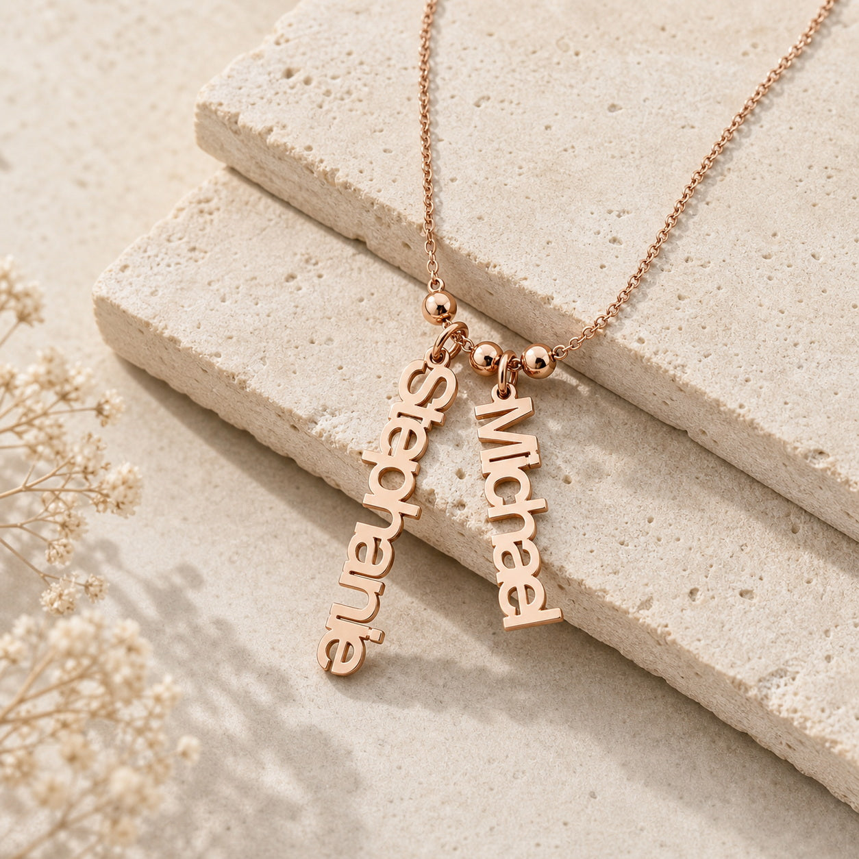 Personalized two name charm necklace on travertine stone