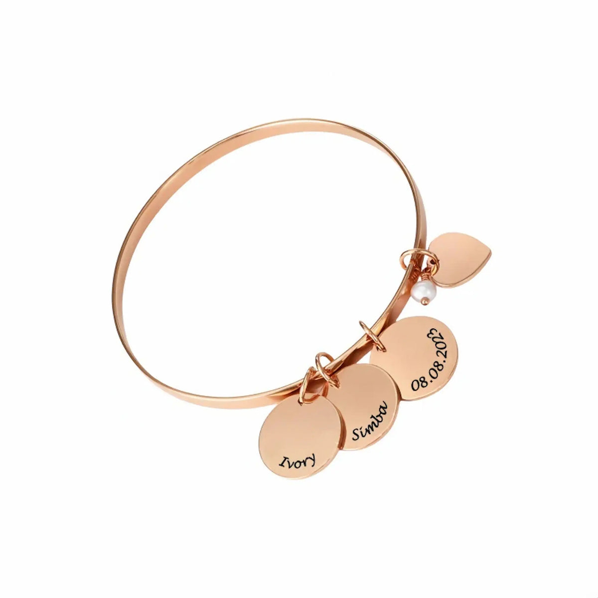 A rose gold bangle bracelet with multiple personalized engraved circular charms and a small pearl accent