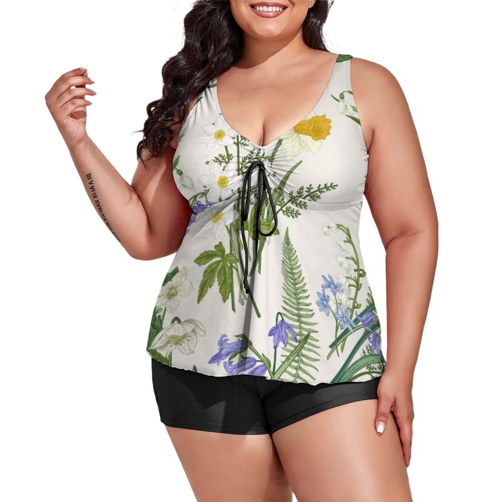 Plus size model in flowy V-neck tankini top and swim shorts for great coverage.