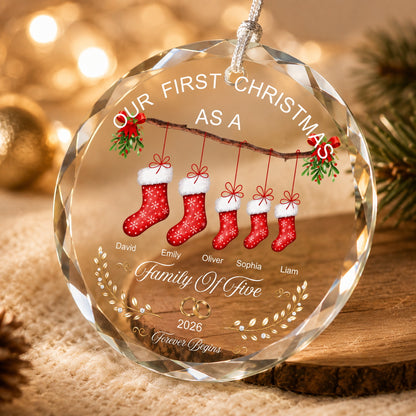 Close-up of a personalized family Christmas ornament showing clear faceted edges, printed stocking design, and festive details