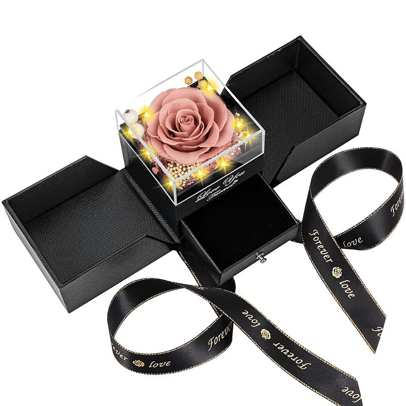 Preserved dusty pink rose jewelry gift box with drawer and lights for romantic gift.