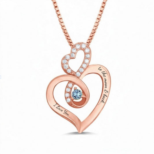 Rose gold double heart necklace with a blue birthstone.