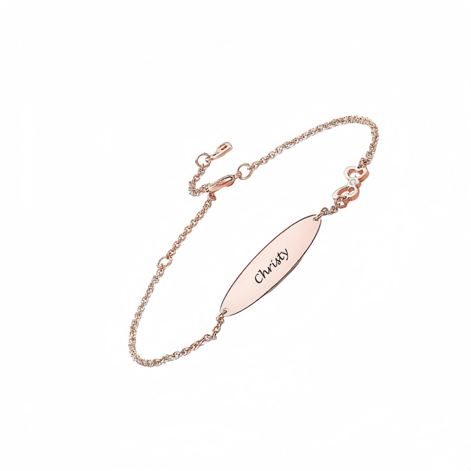 Personalized rose gold ID bracelet with an engraved name and small diamond/cubic zirconia accent.