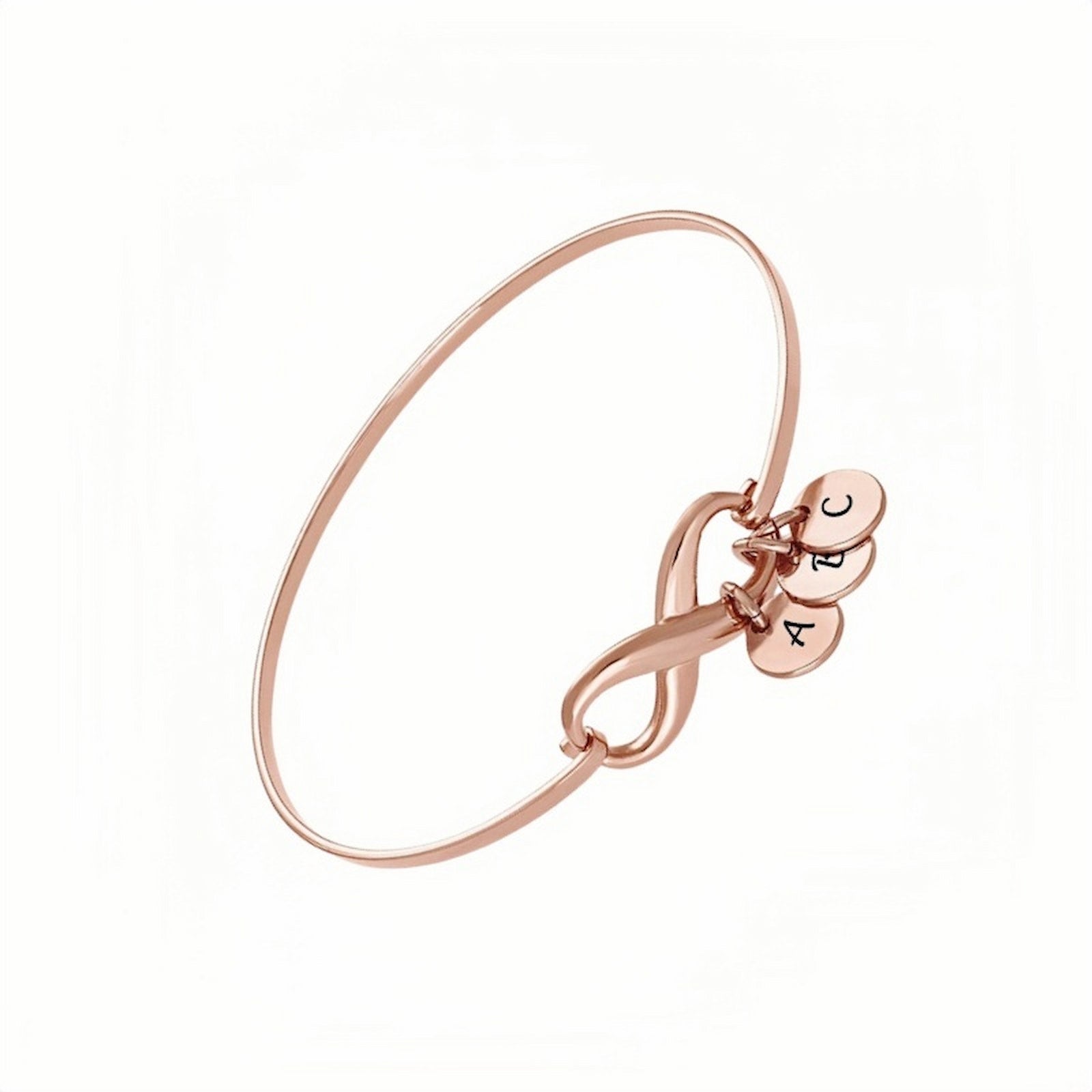 Rose gold personalized infinity bangle. Engraved initial discs, perfect for women.
