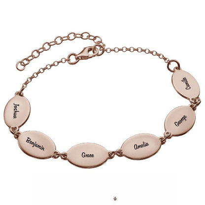 Rose gold personalized mom bracelet. Engraved oval name charms.