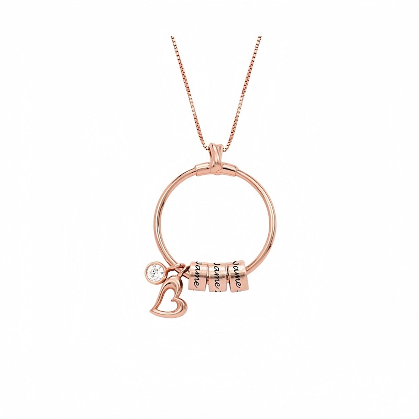 Rose gold version of the personalized circle necklace with four engraved name beads and heart charm, ideal as a custom jewelry gift for Mom.