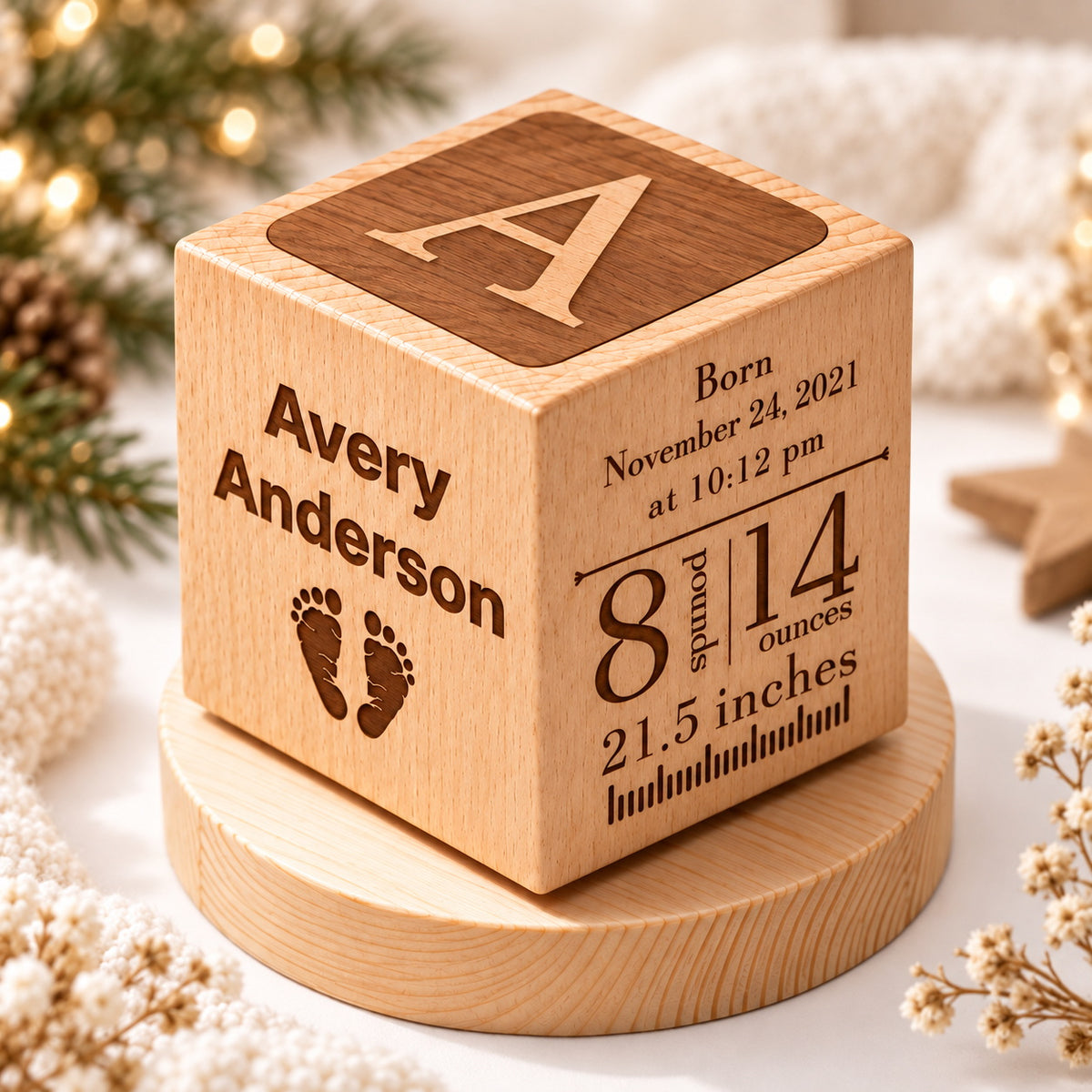 Rotating wooden baby keepsake display with custom name, birth stats, and Baby's First Christmas engraving