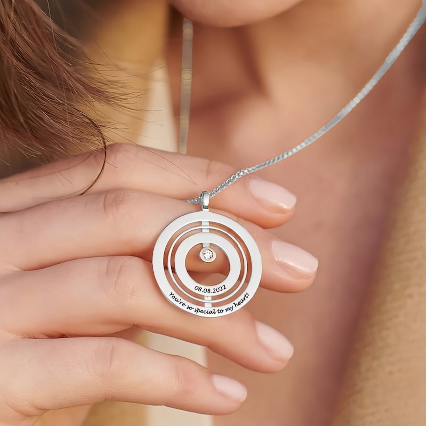 Birthstone Necklace worn by model. Shows how the custom engraved pendant looks.