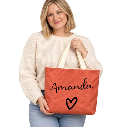 Personalized teacher tote with script name and bold heart design and custom name Amanda, hero view.
