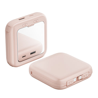 compact pink power bank with mirror and charging cables.