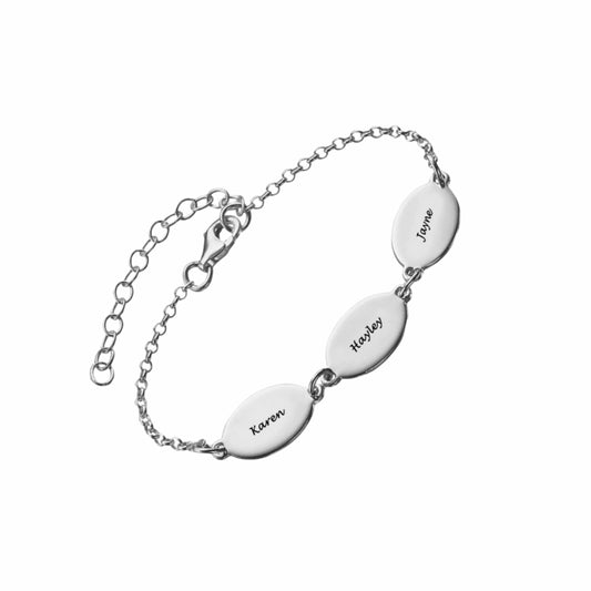 Sterling silver personalized name bracelet. Custom engraved oval charms for mom/family.