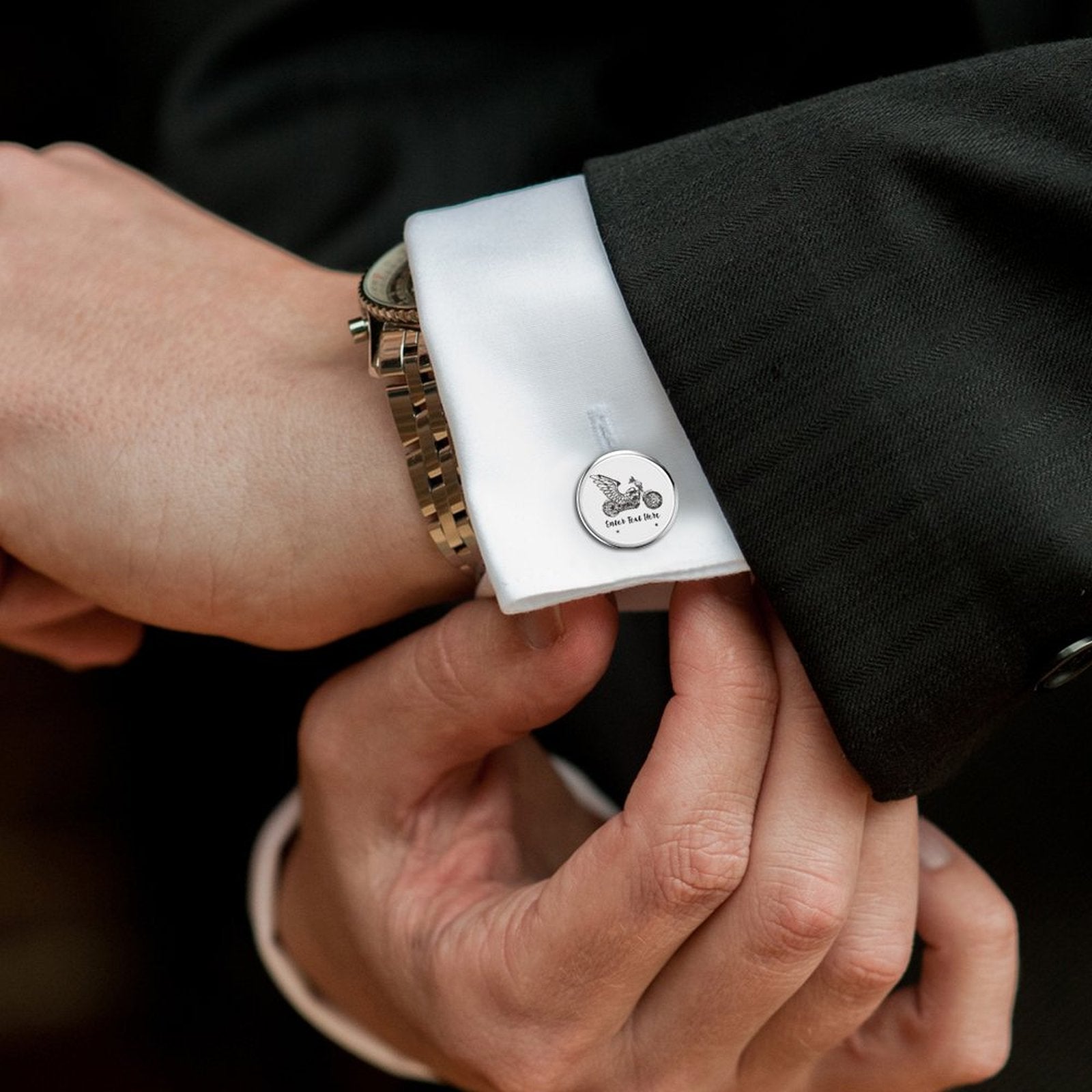 Stylish men's cufflinks worn on a formal dress shirt cuff.