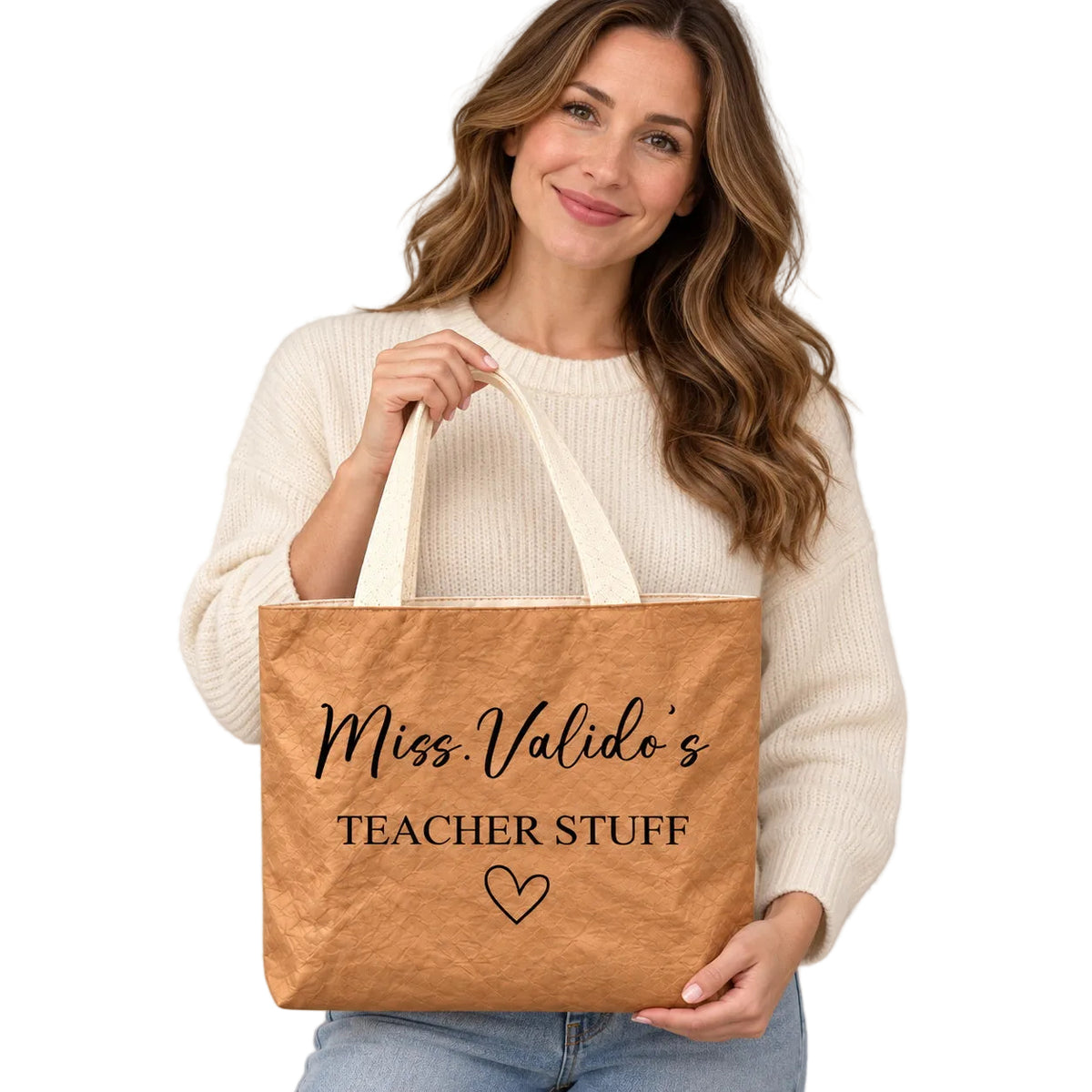 Personalized teacher tote with TEACHER STUFF lettering and an outlined heart and custom name Miss.Valido's, hero view.
