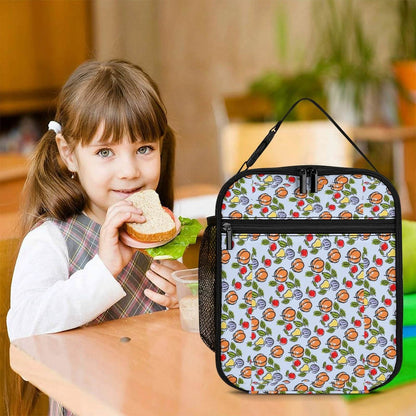 Thermal Lunch Bag for Work used by a girl eating a sandwich at a desk.