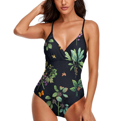 Tummy control one-piece swimsuit for women with a deep V-neck and dark botanical/fruit print.