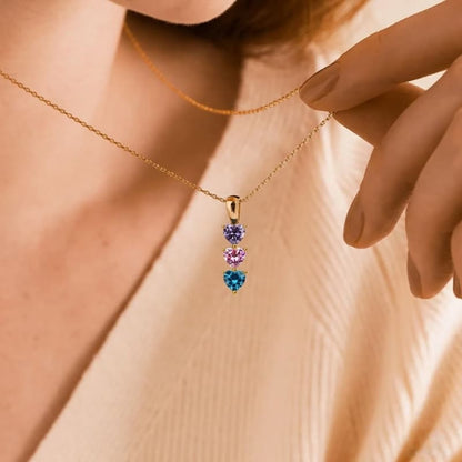 Detailed close-up of the heart pendant setting, emphasizing custom jewelry craftsmanship.