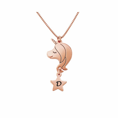 Rose gold personalized unicorn necklace with initial star charm. The perfect personalized Christmas or birthday gift for young girls.