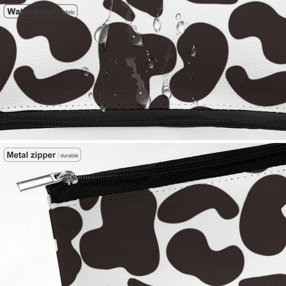 Waterproof Cow Print Makeup Bag showing moisture resistance and droplets on the durable PU leather fabric.