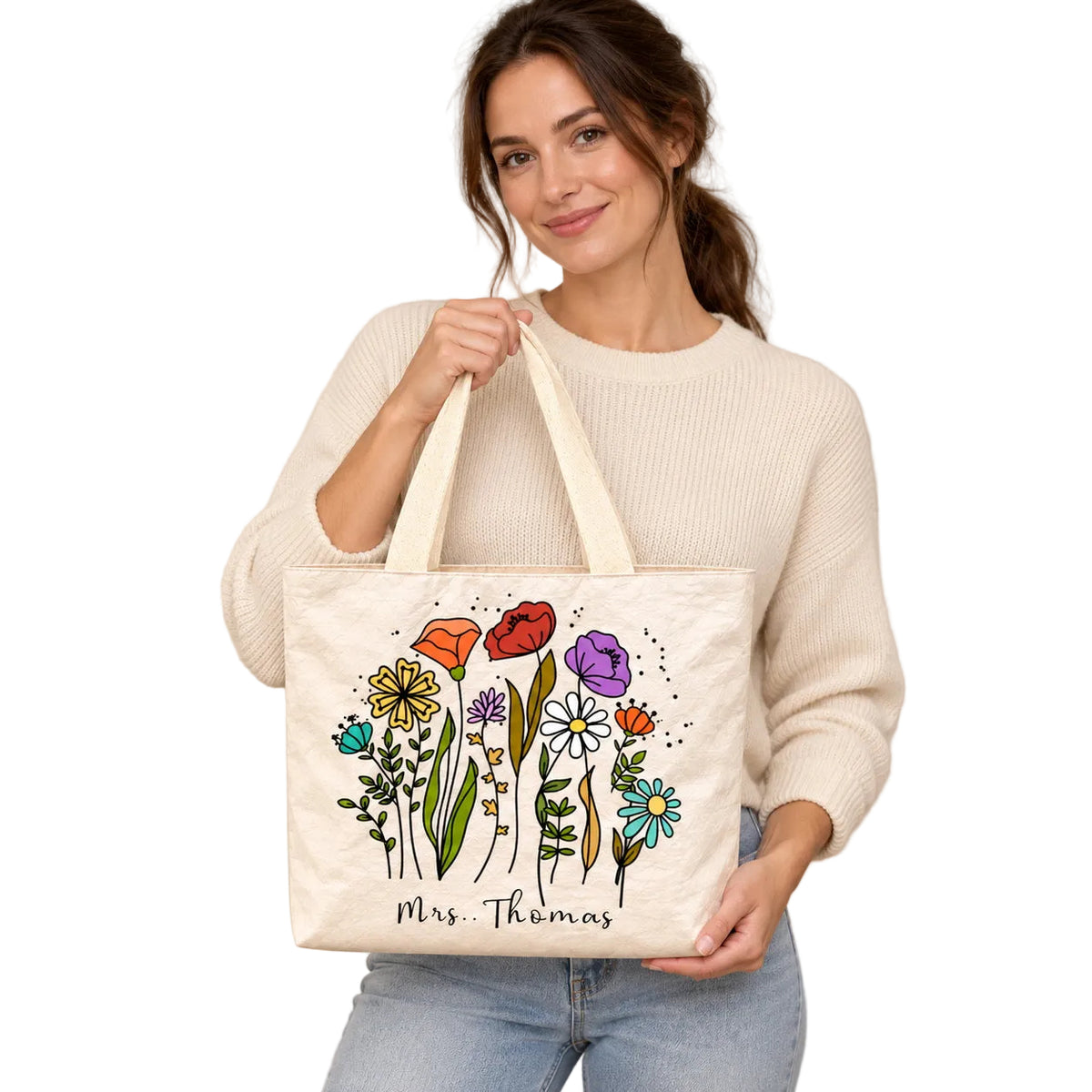 Personalized teacher tote with colorful wildflower artwork and custom name Mrs. Thomas, hero view.