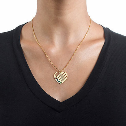 Woman wearing gold personalized Mothers heart necklace, custom names and birthstones.