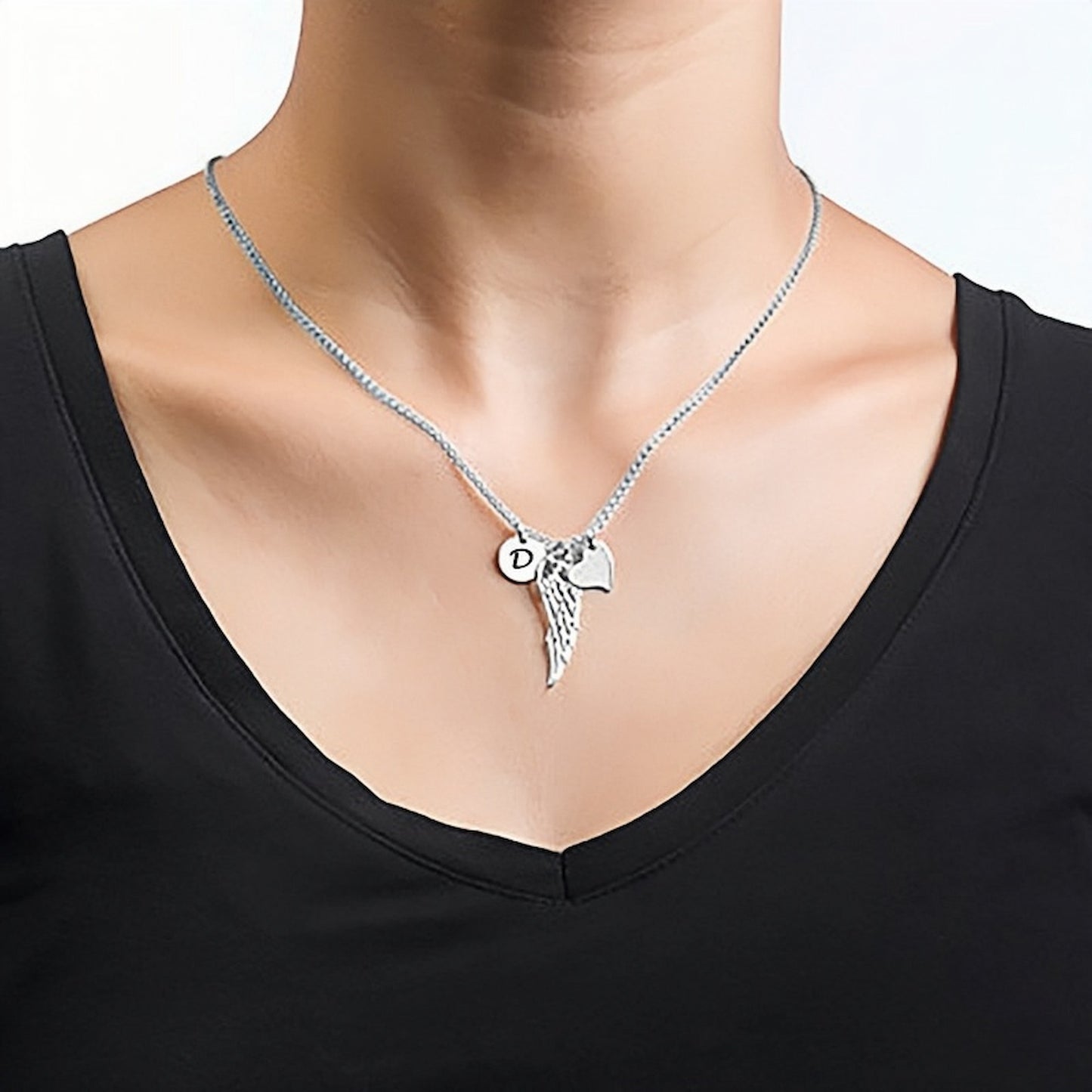 Woman wearing the 925 Sterling Silver Personalized Angel Wing Necklace.
