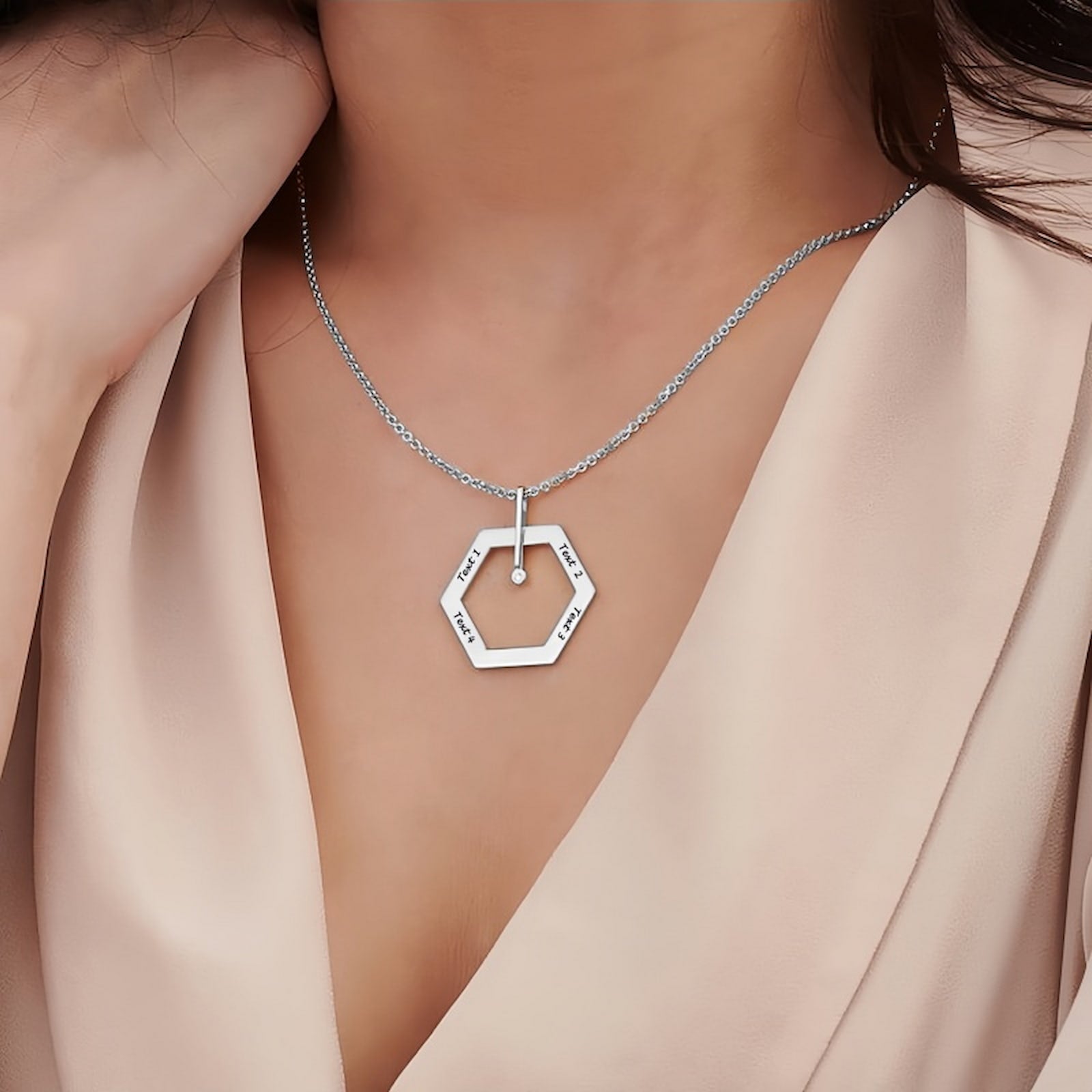Woman wearing Sterling Silver Personalized Hexagon Necklace. Minimalist custom engraving.