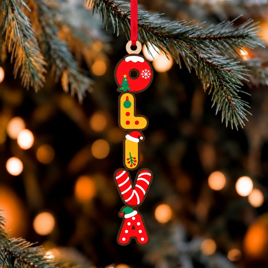 Wooden Christmas name ornament hanging on tree